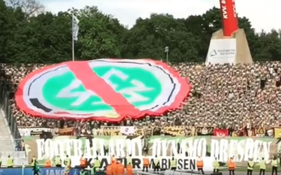Fans pass around massive anti German Football Federation banner