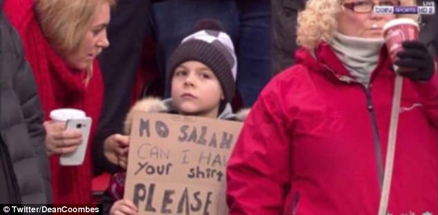 The boy had sat through Liverpool's 2-2 draw with Tottenham holding a cardboard sign