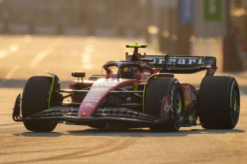 Ferrari driver Carlos Sainz of Spain steers his car during the first practice session of the Singapore Formula One Grand Prix at the Marina Bay Street Circuit, Singapore,Friday, Sept. 15, 2023. (AP Photo/Vincent Thian)